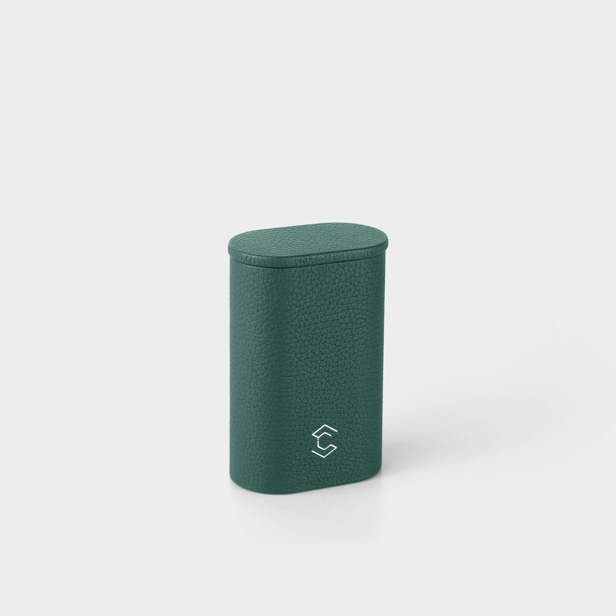 Product photo of closed upright Oscar 1 Watch roll. Handmade from emerald leather to store and transport one watch with a metal bracelet.