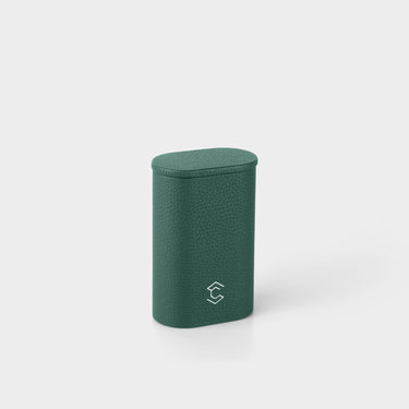Product photo of closed upright Oscar 1 Watch roll. Handmade from emerald leather to store and transport one watch with a metal bracelet.